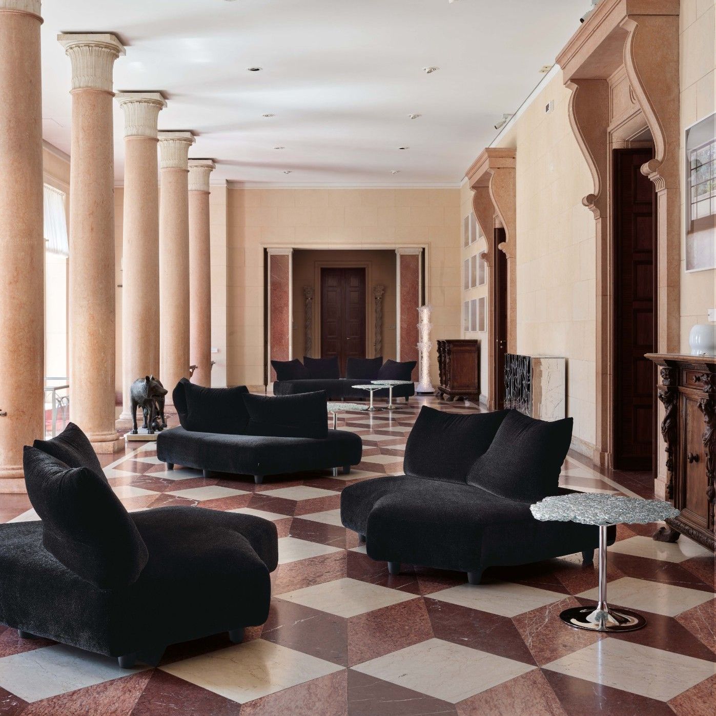  Anywhere, Diamante, Dilly, Scrigno. 
The Tasty Soft seating, tables, cabinet and silver lamp in the colonnaded gallery on the piano nobile. 