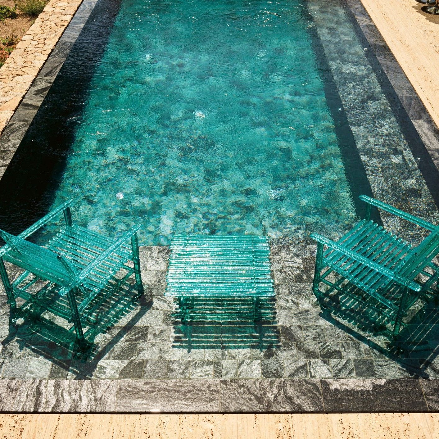 A&rsquo;mare. 
Armchairs and tables from the outdoor collection merge matter, light and transparency. 