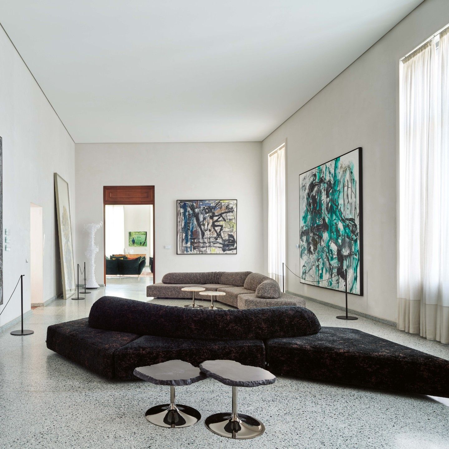  The sofas in Gems Jasper and Minerals Limonite, together with the tables in natural and anthracite alabaster, create an intimate setting from which to contemplate Vedova&rsquo;s works. 